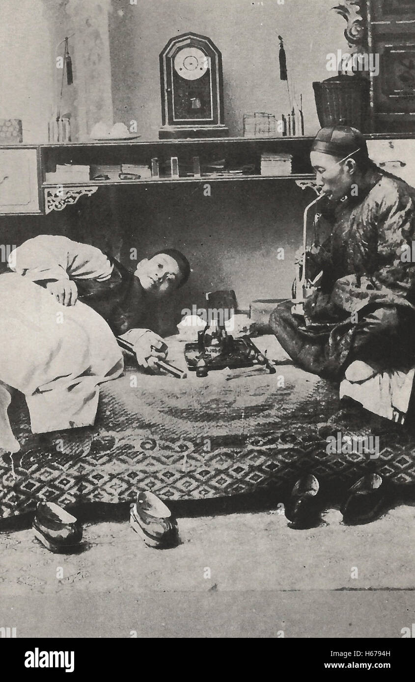 Opium Smoking - China, circa 1910 Stock Photo