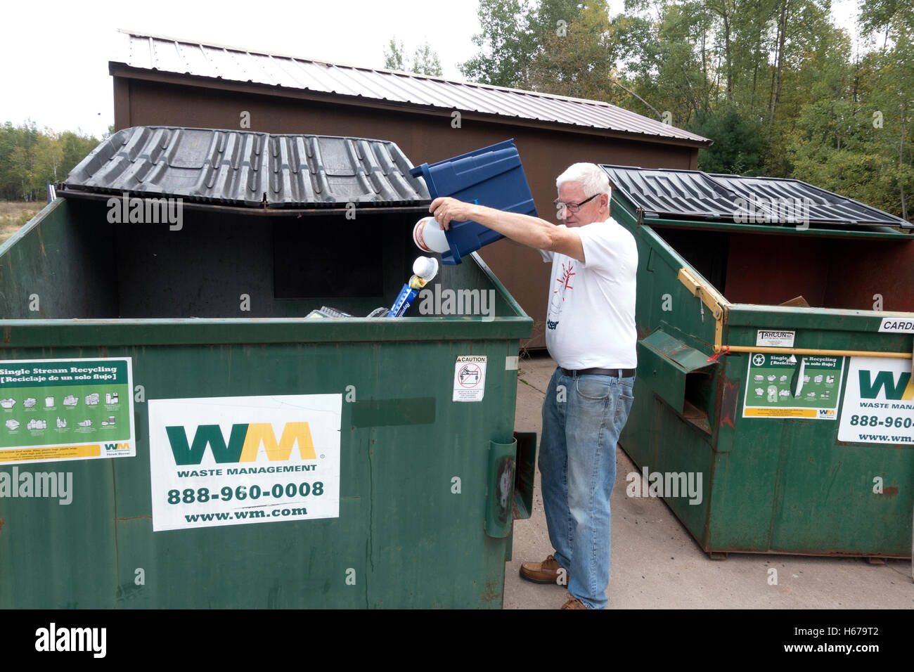 Senior citizen doing his duty dumping recyclable material into a