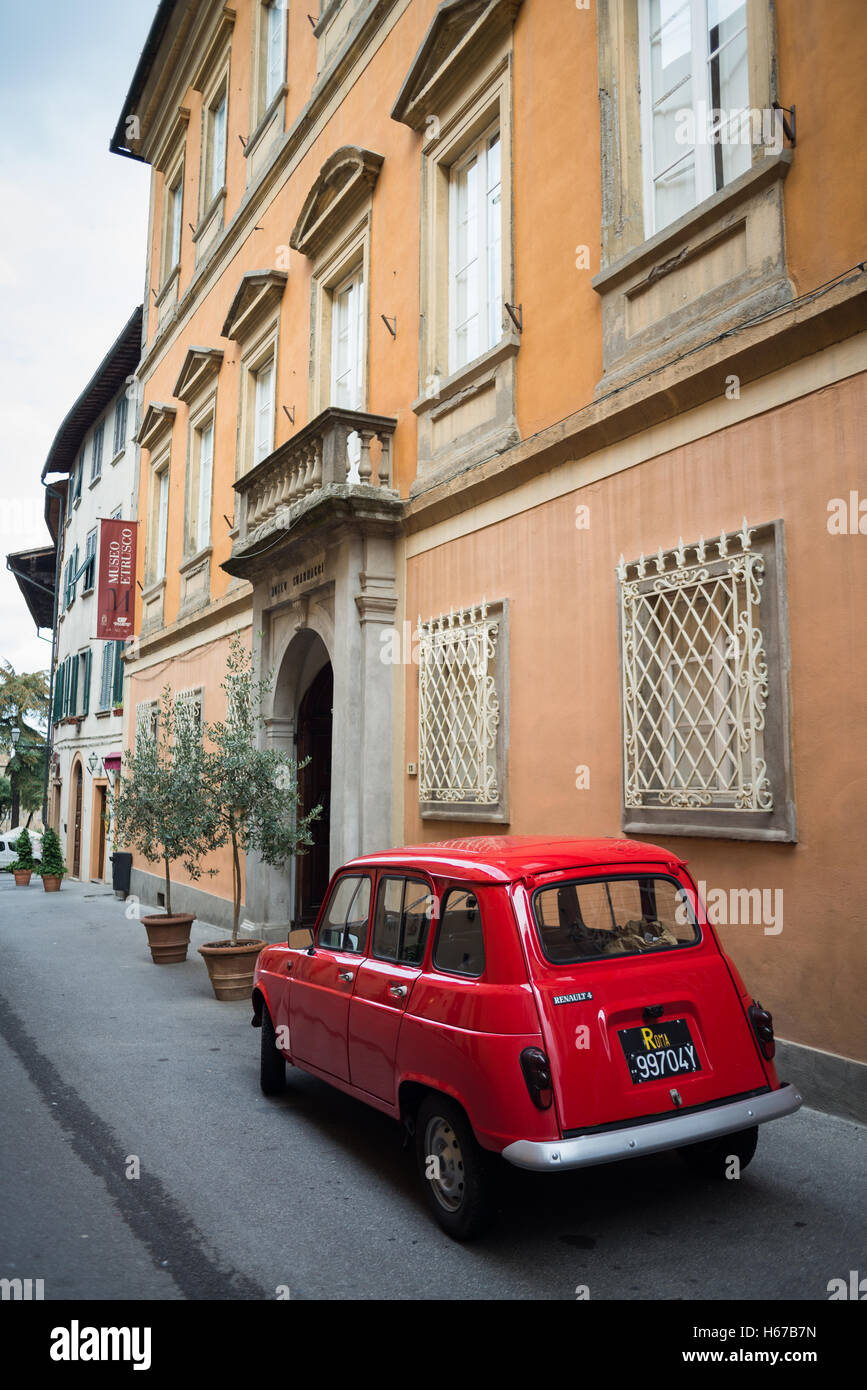 red Renault 4 in the street of the Volterra, Tuscany, Italy, EU, Europe Stock Photo