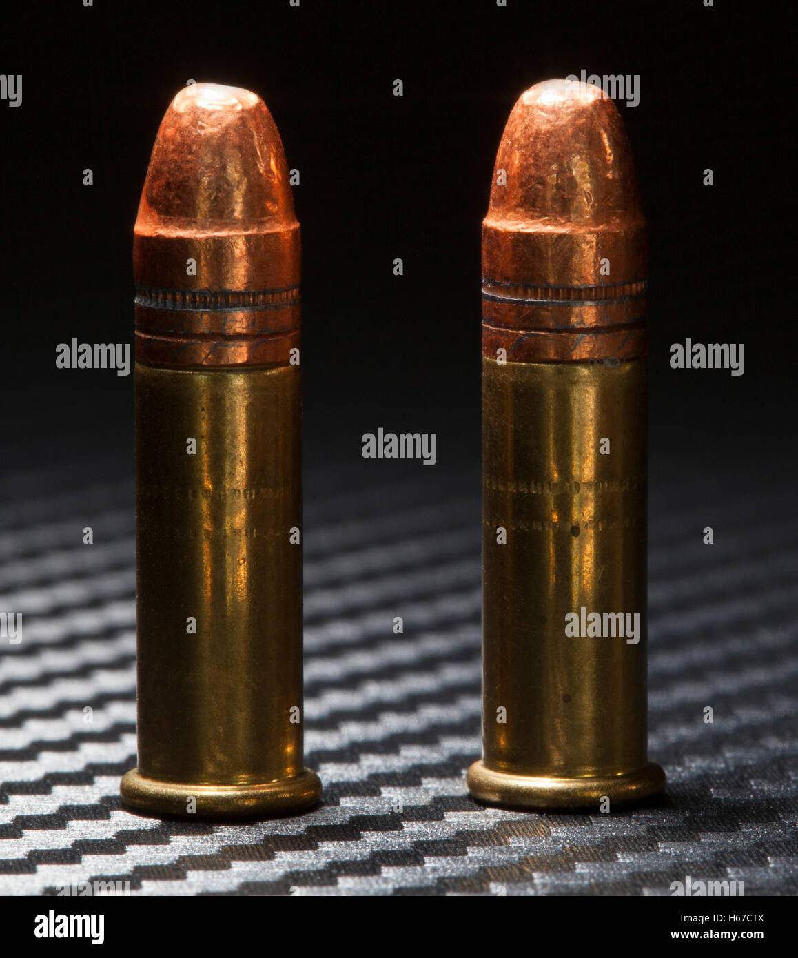Two rimfire cartridges used in rimfire twenty two guns Stock Photo Alamy