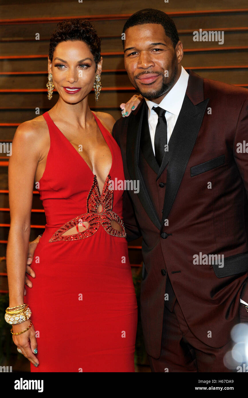 Nicole Murphy (l) and Michael Strahan attends the 2014 Vanity Fair Oscar Party on March 2, 2014 in West Hollywood, California. Stock Photo