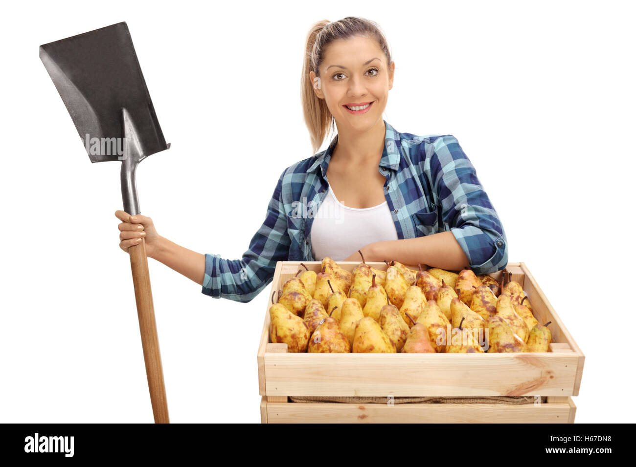 Female agricultural worker posing with a crate full of pears and a ...