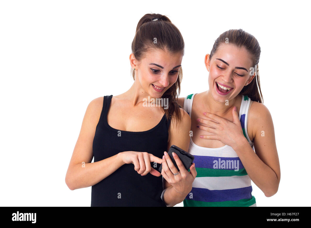 Two young women using smartphone Stock Photo - Alamy