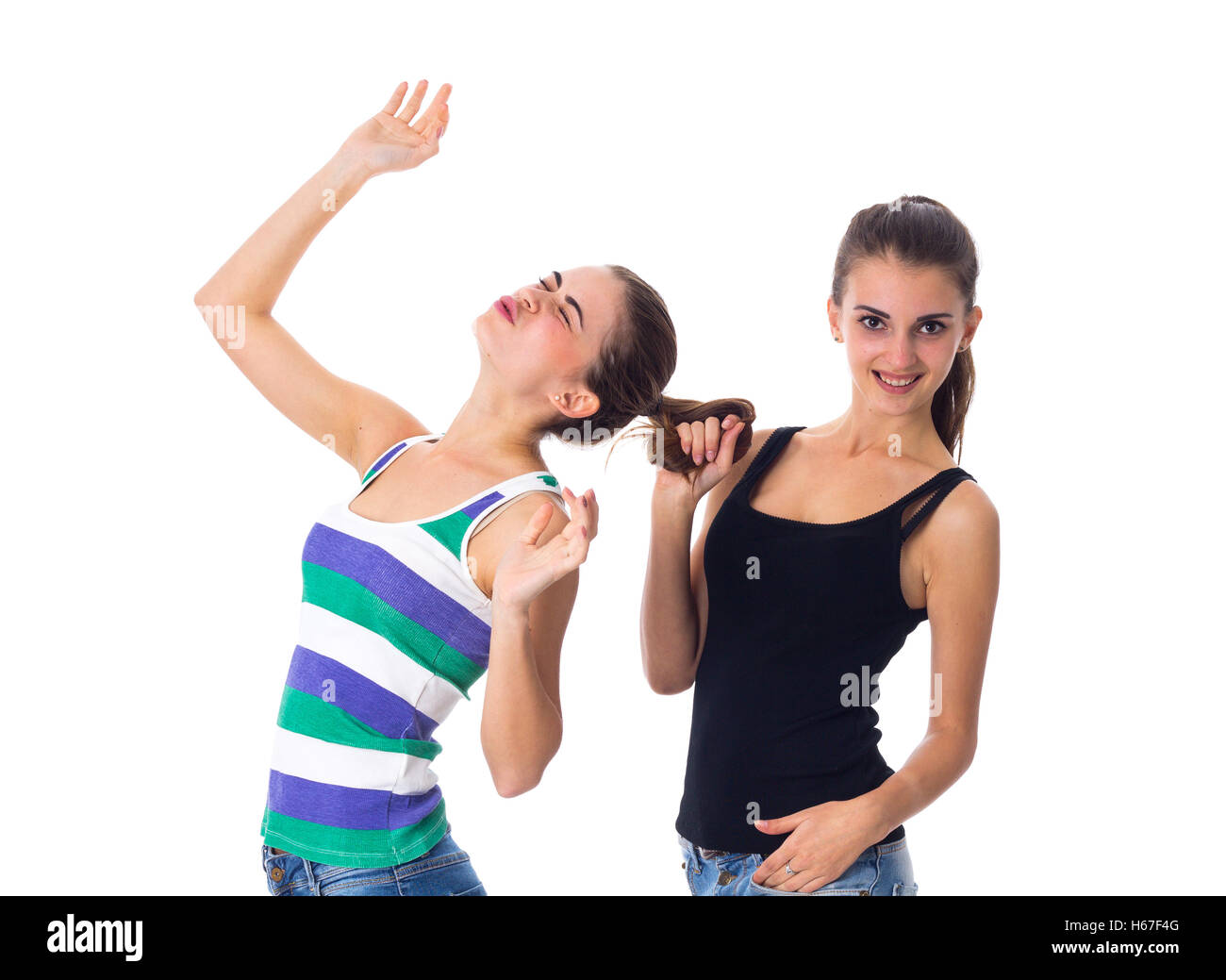 Young woman holding another woman's hair Stock Photo