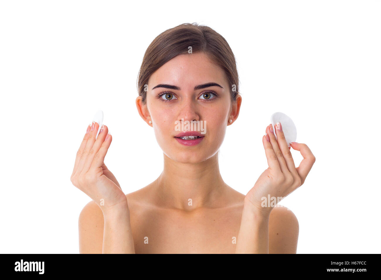 Young woman holding cotton pads Stock Photo