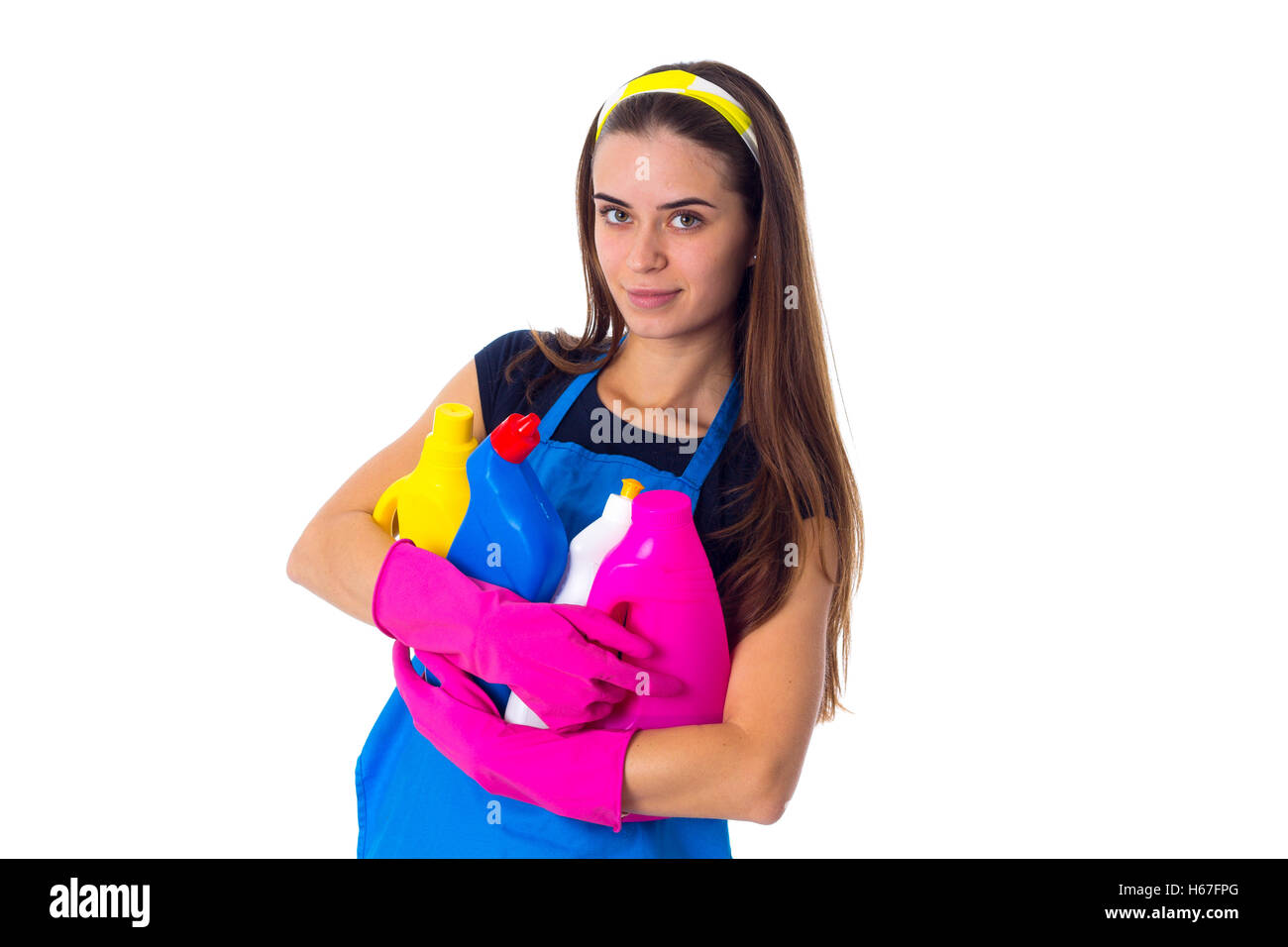 Woman in apron holding a detergents Stock Photo - Alamy