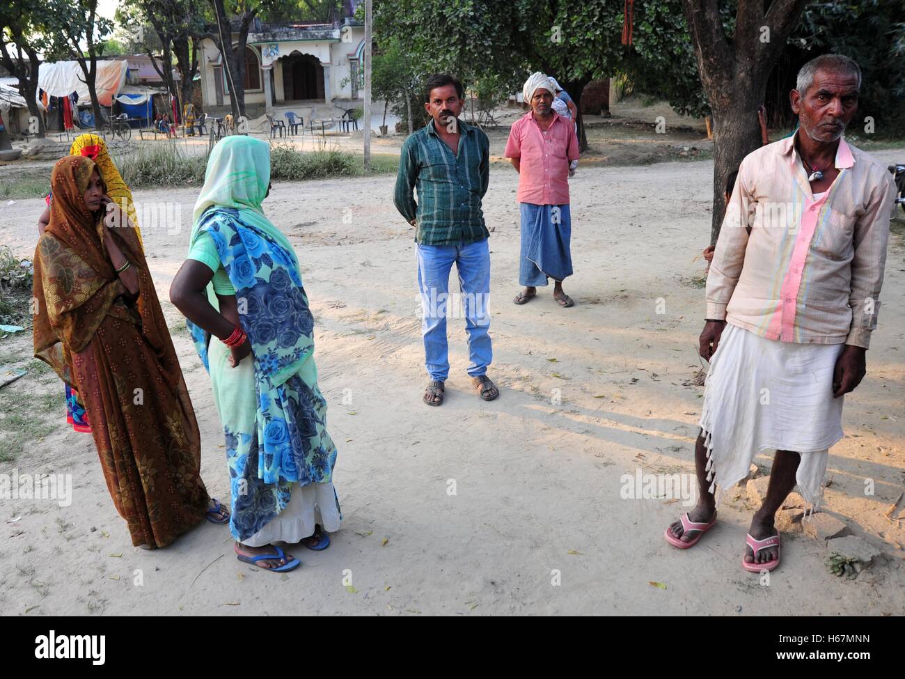 Allahabad, India. 24th Oct, 2016. Villagers gathered in near Dharmendra house as a Dharmendra alleged died of hunger at Mauaima village. A 28-year-old unemployed Dalit man Dharmendra allegedly died of hunger in a village of Uttar Pradesh's Allahabad district on Sunday morning. His wife Usha Devi too was found fighting for life without a morsel of food in their home. The district administration, however, instructed action against the local officials and the owner of the fair price shop, which provides government subsidized food to the poor. © Prabhat Kumar Verma/Pacific Pres/Alamy Live News Stock Photo