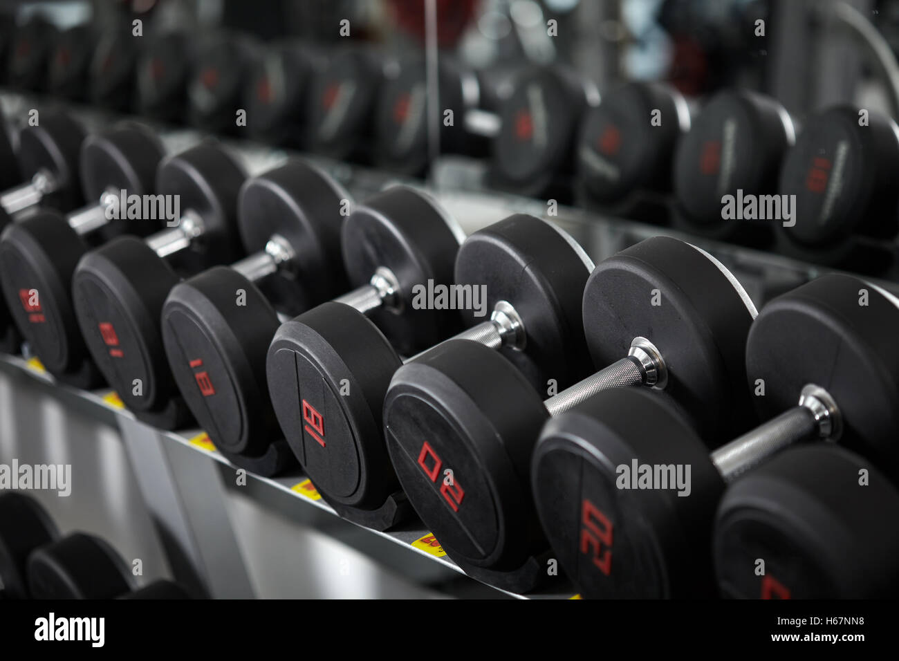 Many dumbbells on rack hi-res stock photography and images - Alamy