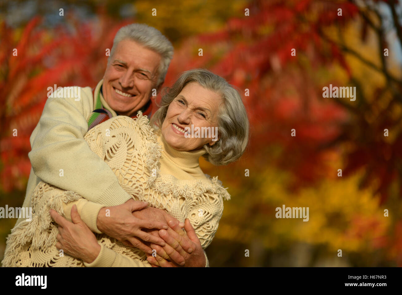 Senior couple in autumn park Stock Photo - Alamy