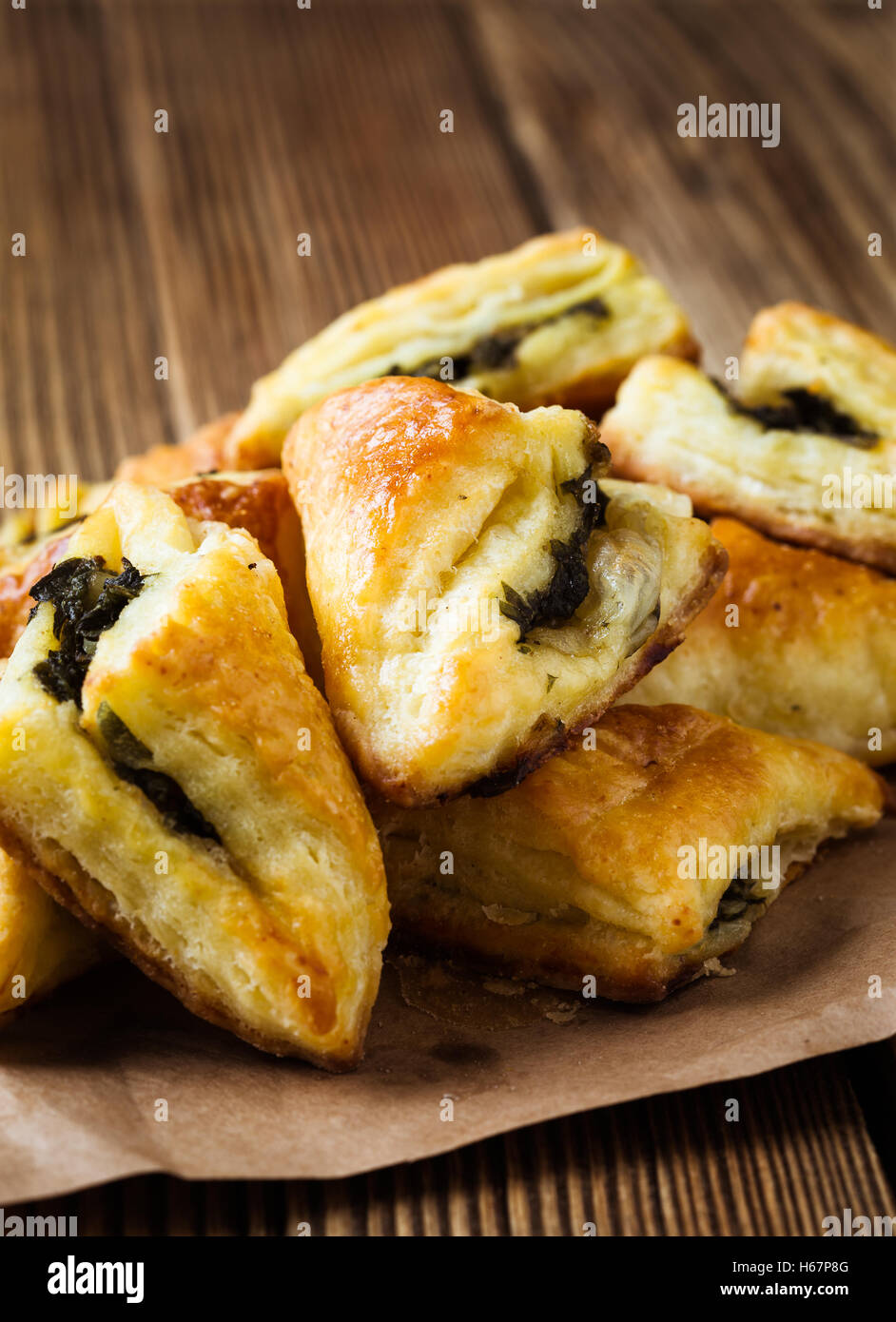 Spinach and cheese puff pastries triangles Stock Photo Alamy