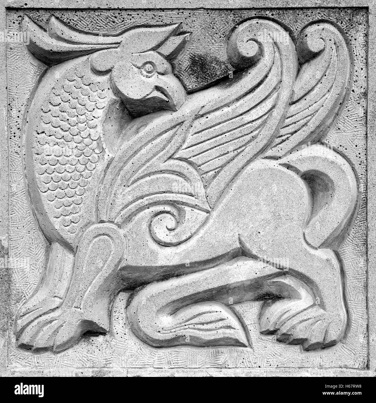 big winged fairy lion, stone bas-relief on the wall Stock Photo