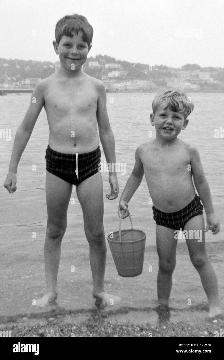 two young brothers at the seaside in seaton devon england 1960s Stock Photo