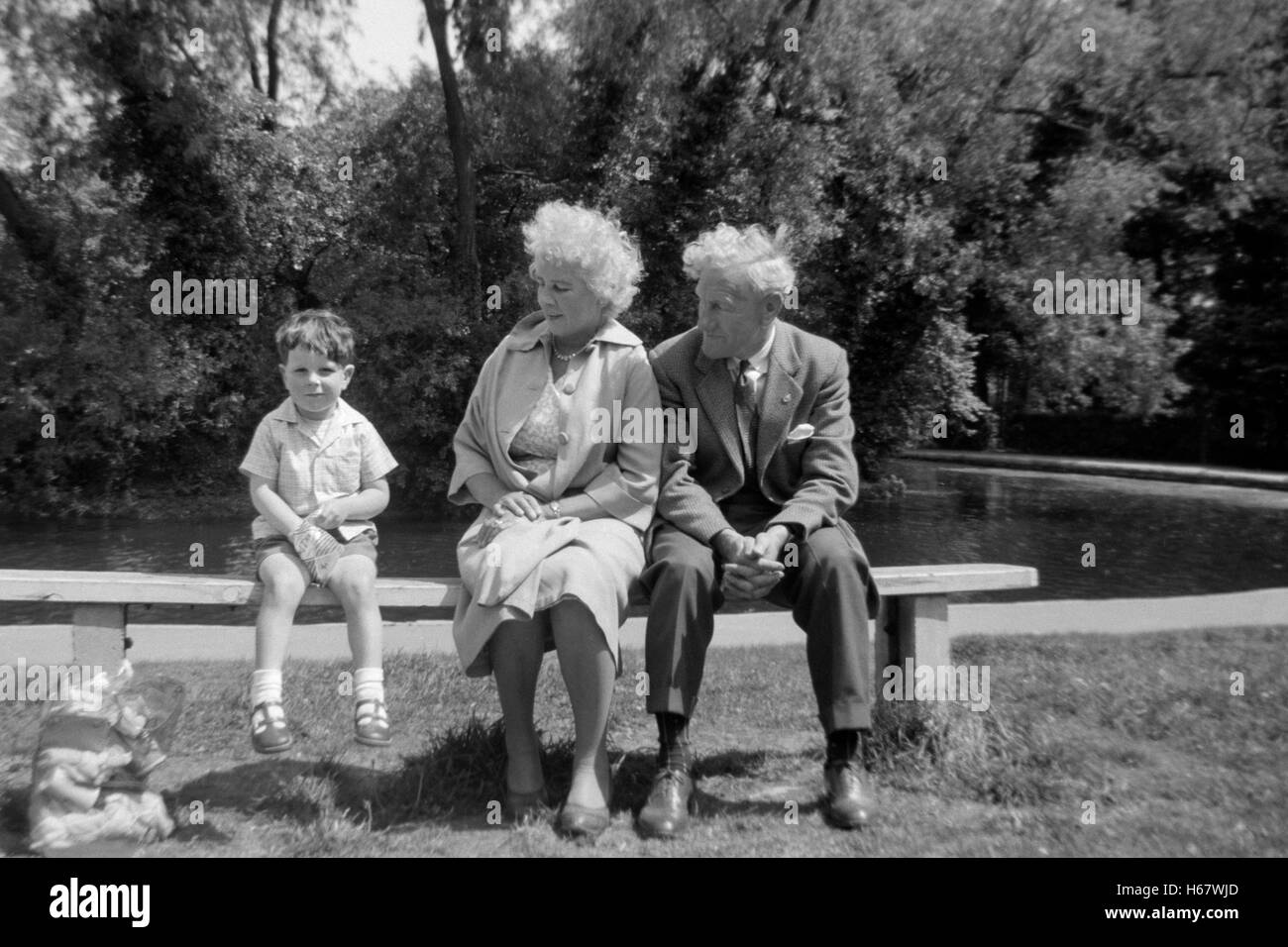 grandparents with grandchild in a public park england uk 1960s Stock Photo