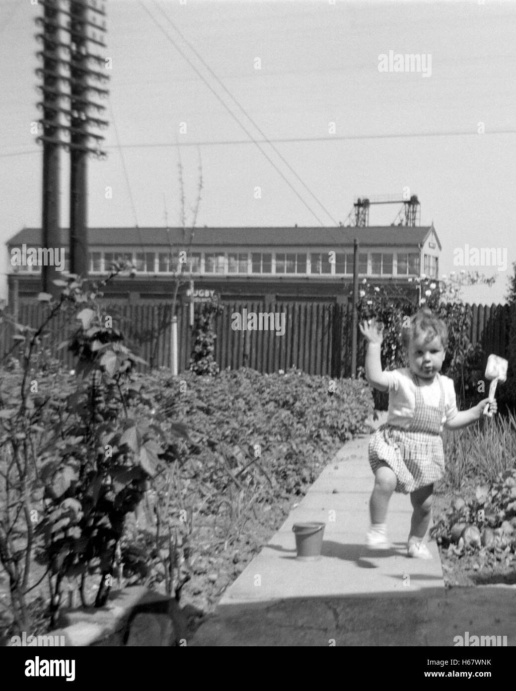 young boy playing in garden with bucket and spade england uk 1950s Stock Photo