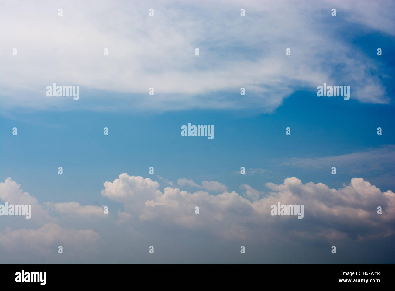 Blue cloudy sky with white and grey clouds Stock Photo - Alamy