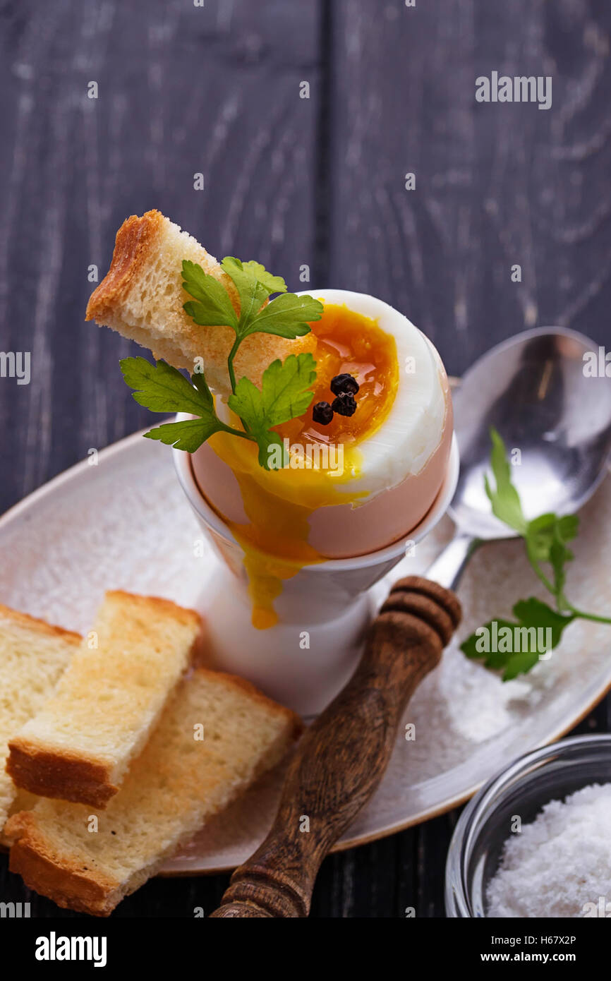 Soft-boiled egg and toasts. Selective focus Stock Photo