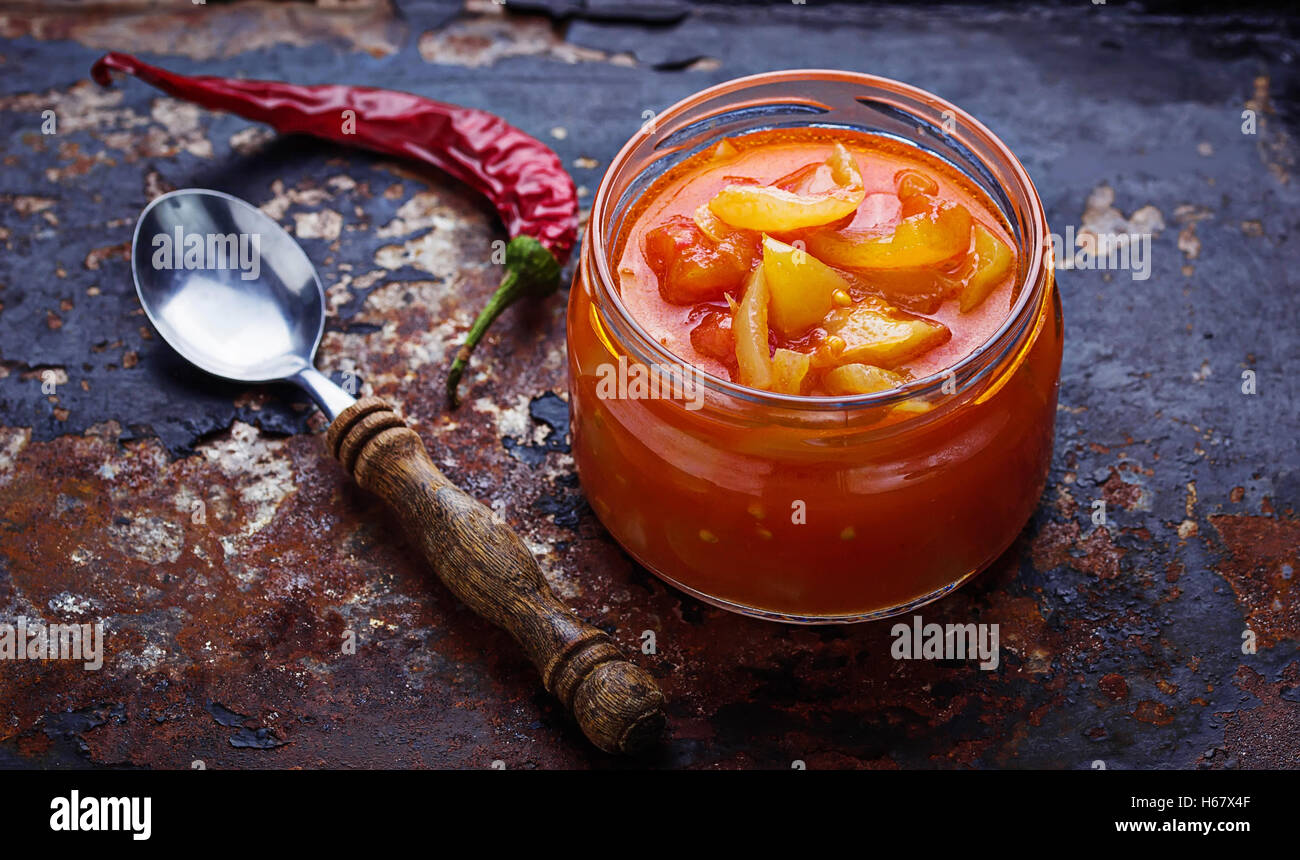 Pickled bulgarian peppers  in a glass jar. Selective focus Stock Photo