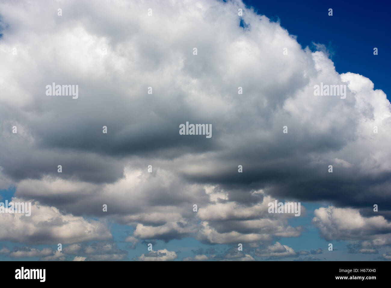 Blue cloudy sky with white and grey clouds Stock Photo Alamy