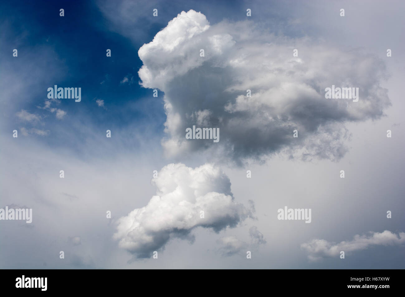 Blue cloudy sky with white and grey clouds Stock Photo - Alamy