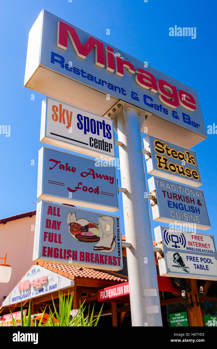 Signs for a restaurant, cafe and bar in Turkey, offering Sky Sports, takeaway food, full English
