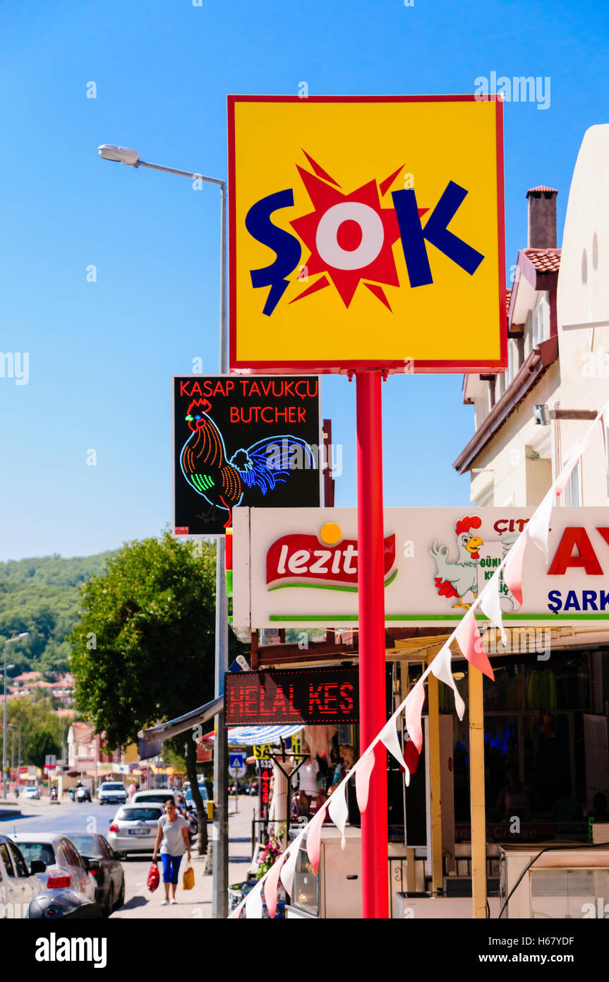 Signs in a Turkish town for Sok Supermarker, a halal butcher and other shops. Stock Photo