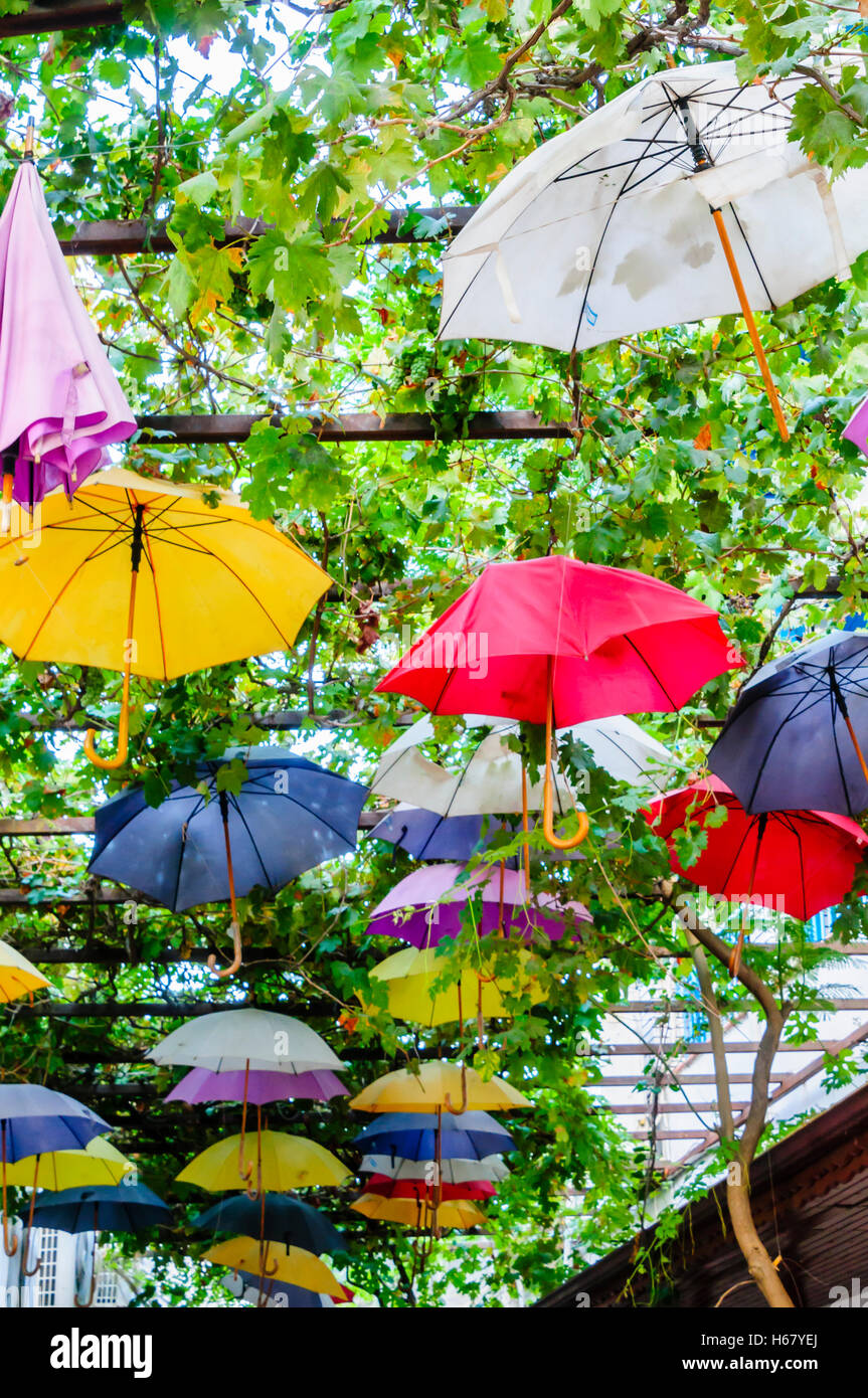 Multicoloured umbrellas line the roof of Fethiye Market, Turkey Stock Photo