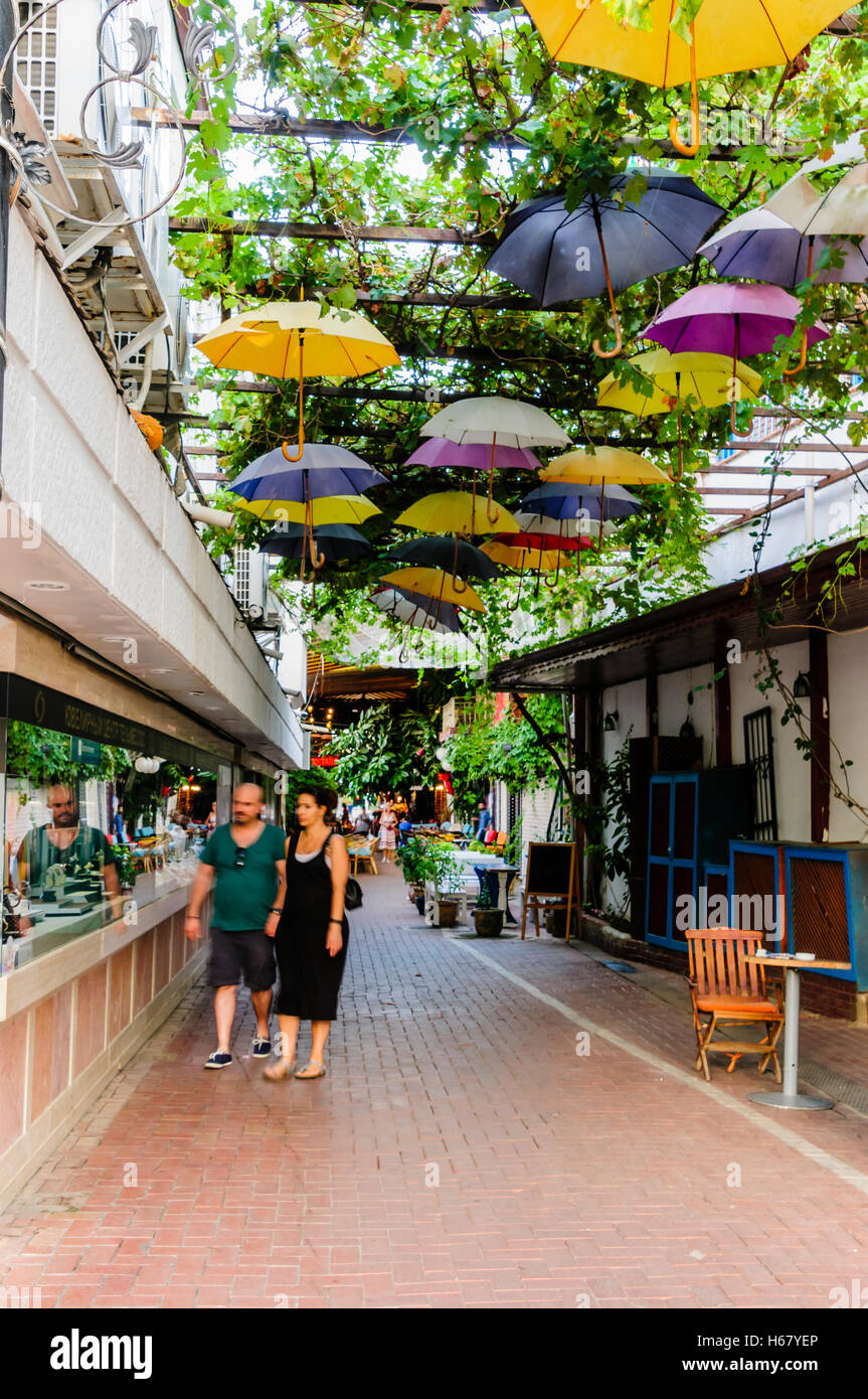 Multicoloured umbrellas line the roof of Fethiye Market, Turkey Stock Photo
