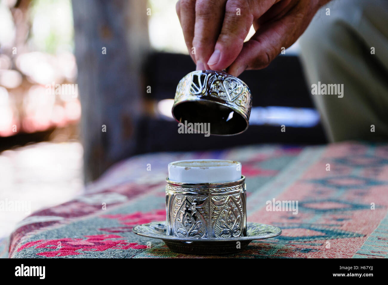 Ornately decorated silver Turkish coffee cups with lids Stock Photo Alamy