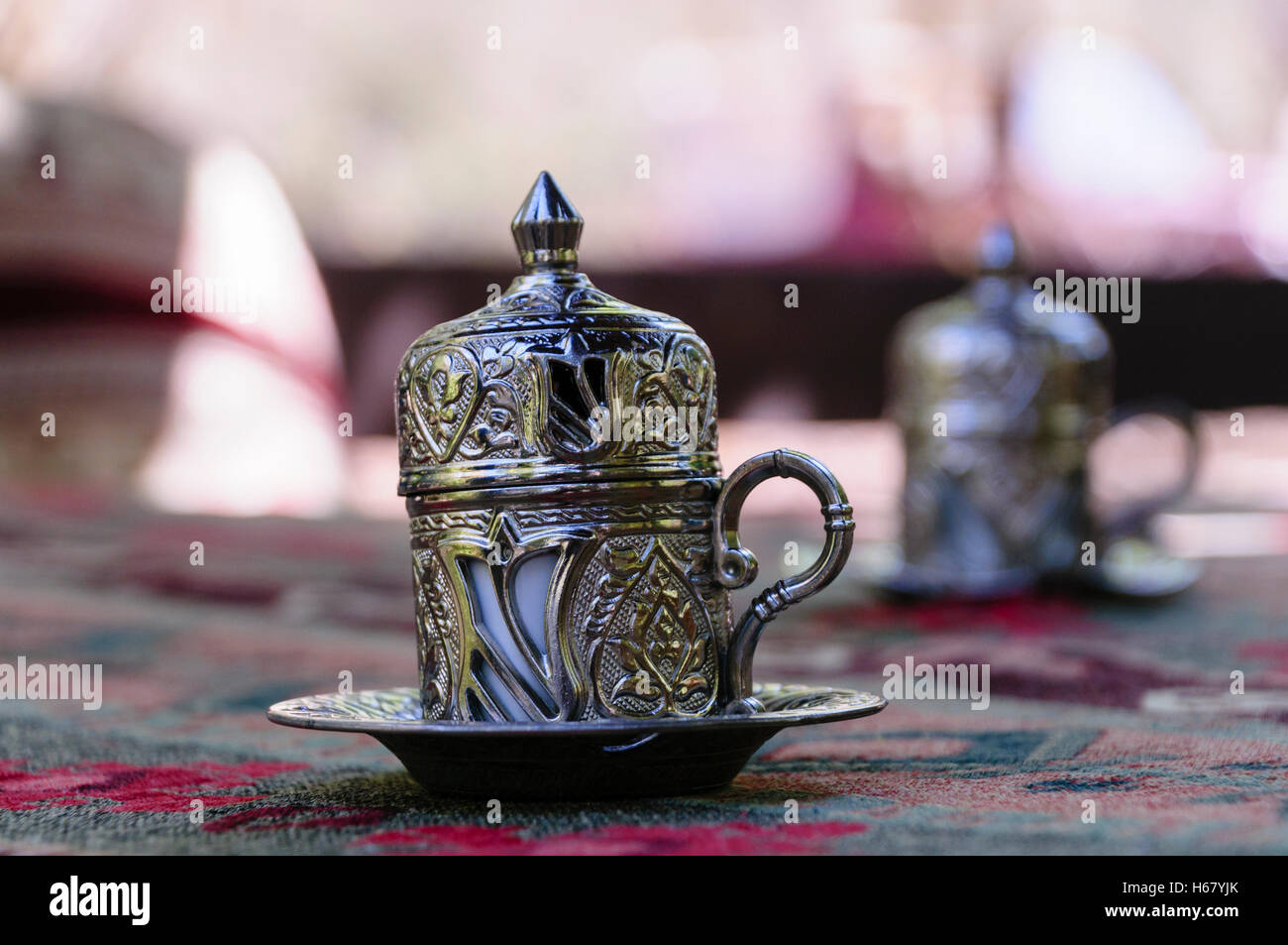 Ornately decorated silver Turkish coffee cups with lids Stock Photo Alamy