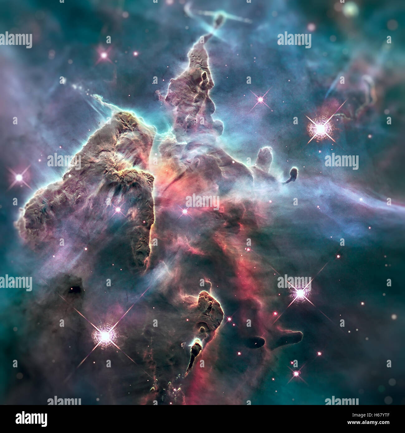 Mystic Mountain. Region in the Carina Nebula imaged by the Hubble Space Telescope. Elements of this image furnished by NASA. Stock Photo