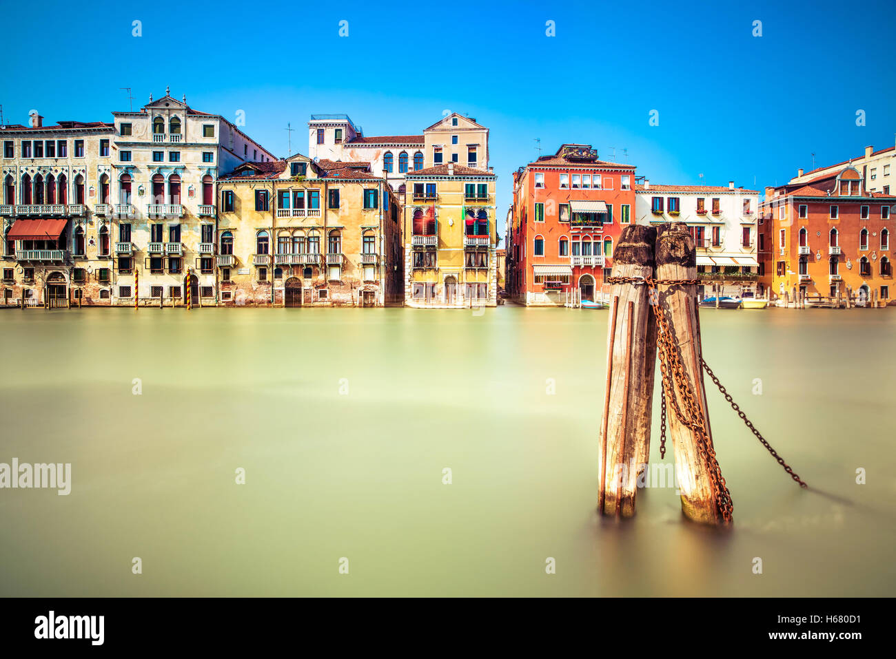 Venice cityscape, water grand canal and traditional buildings facade. Italy, Europe. Long exposure photography. Stock Photo