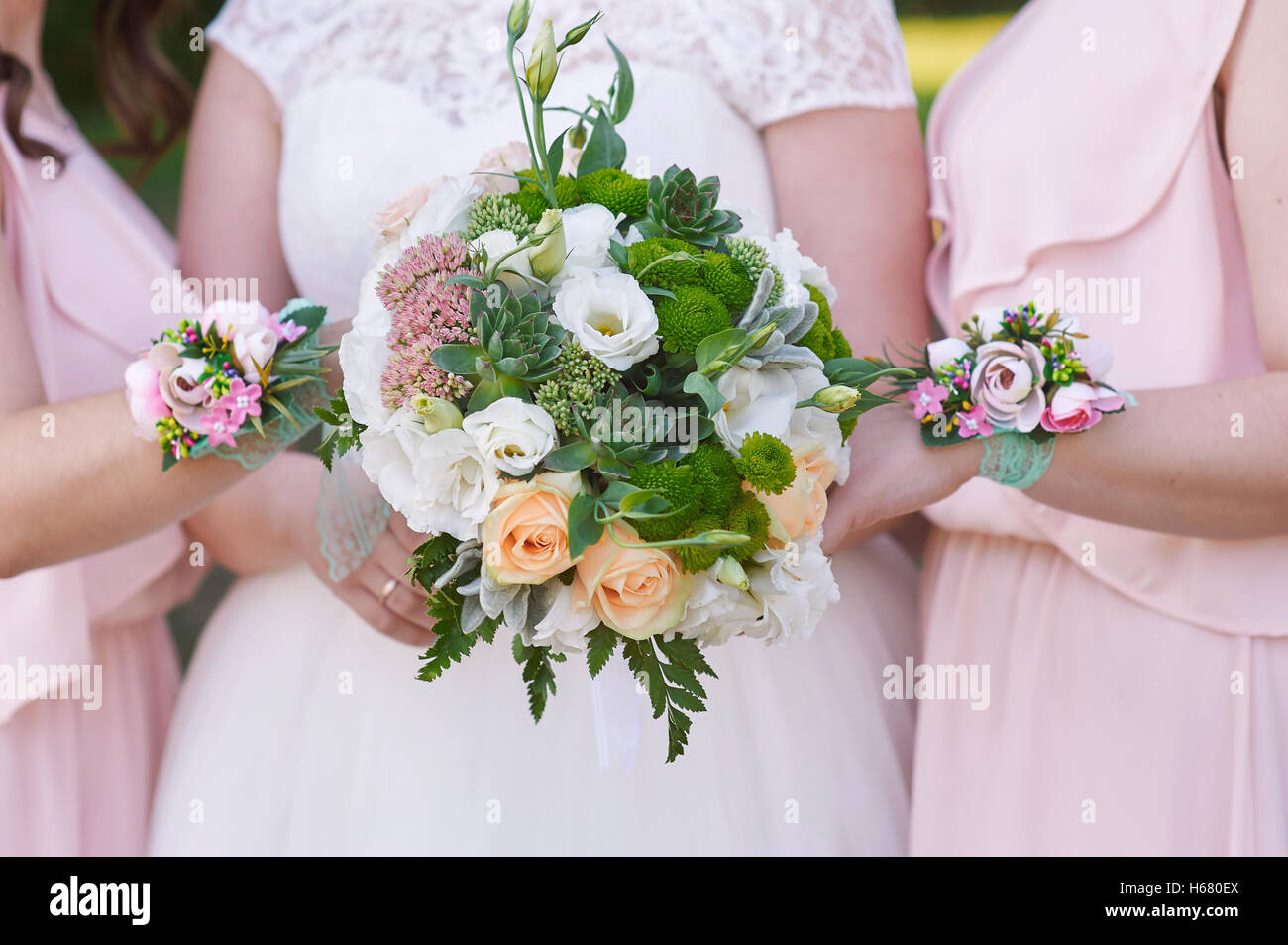 bride with bridesmaids are holding wedding bouquets Stock Photo - Alamy
