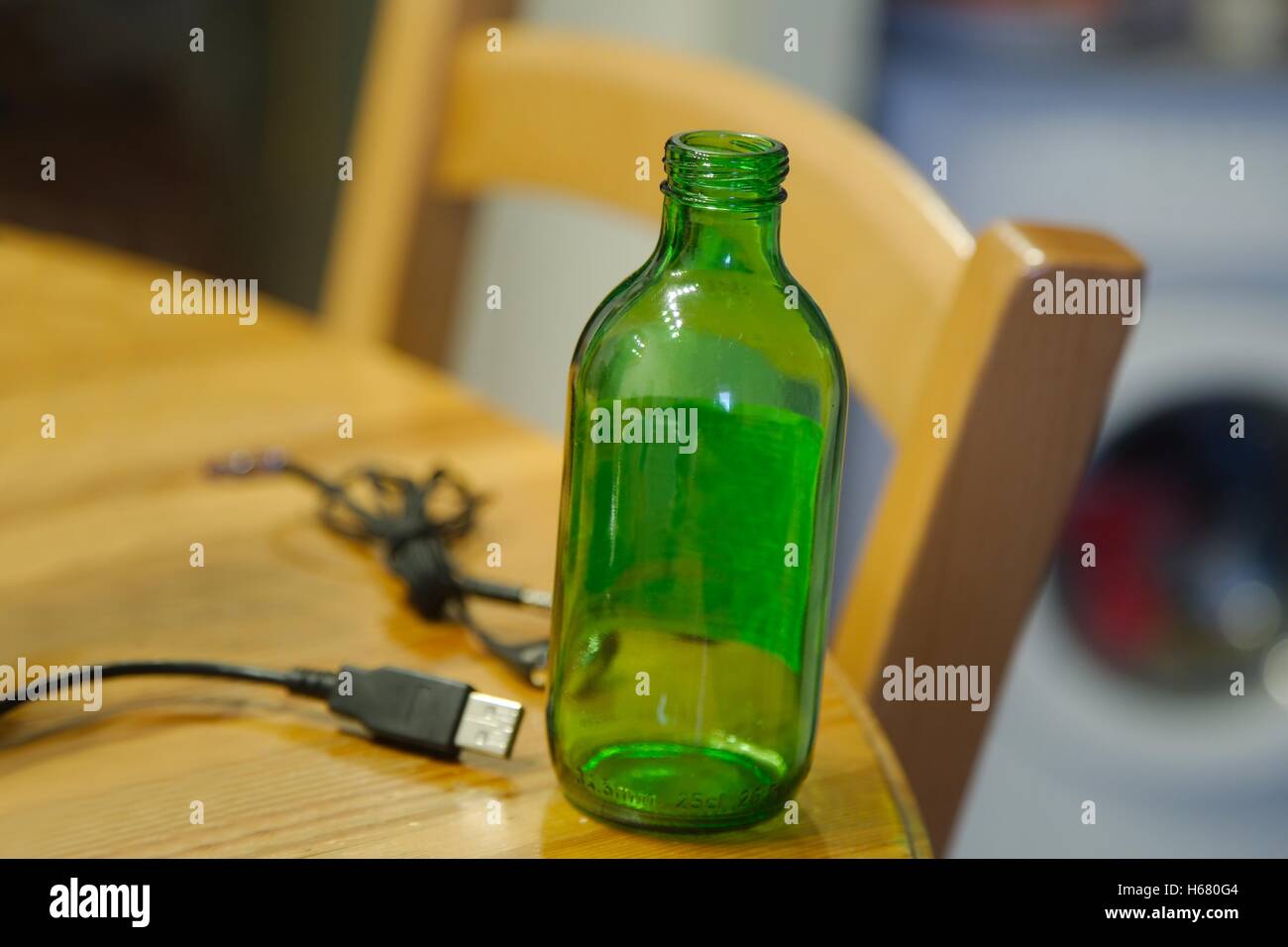 Empty bottle on table Stock Photo
