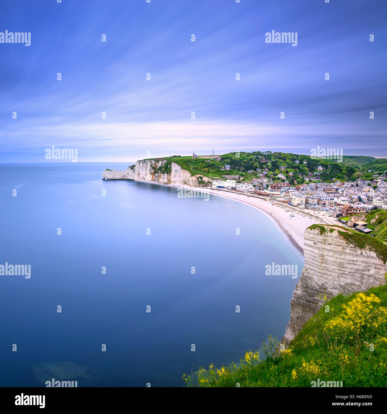 Etretat village and its bay beach, aerial view from cliff. Normandy, France, Europe. Long exposure photography Stock Photo