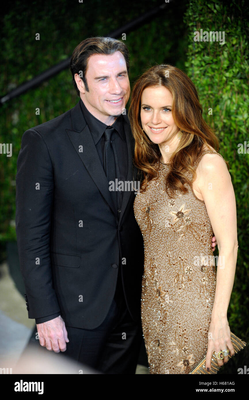 Actor John Travolta and wife Kelly Preston arrive for the 2013 Vanity Fair Oscar Party hosted by Graydon Carter at Sunset Tower on February 24, 2013 in West Hollywood, California. Stock Photo