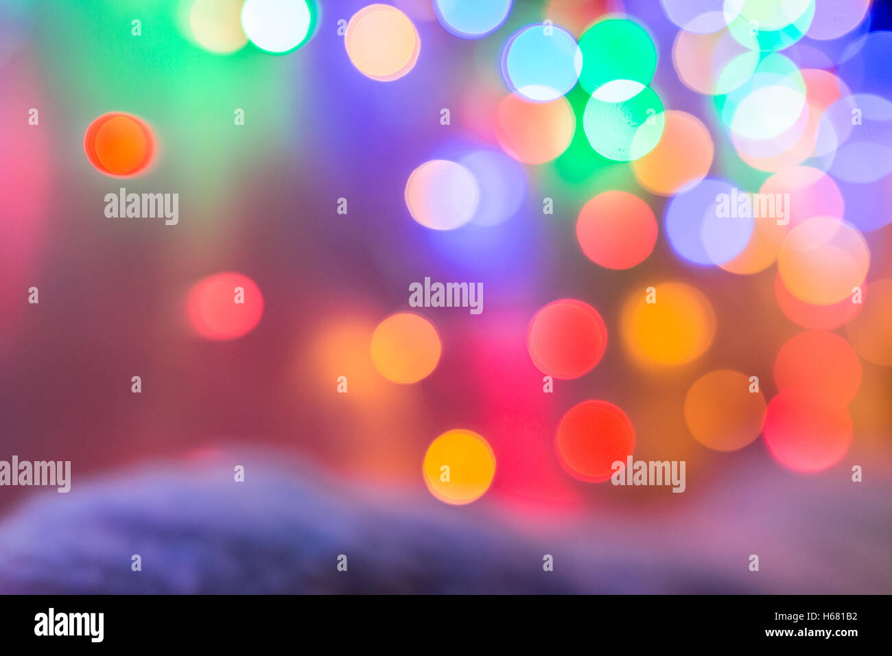 Christmas background with blurred colored lights Stock Photo - Alamy