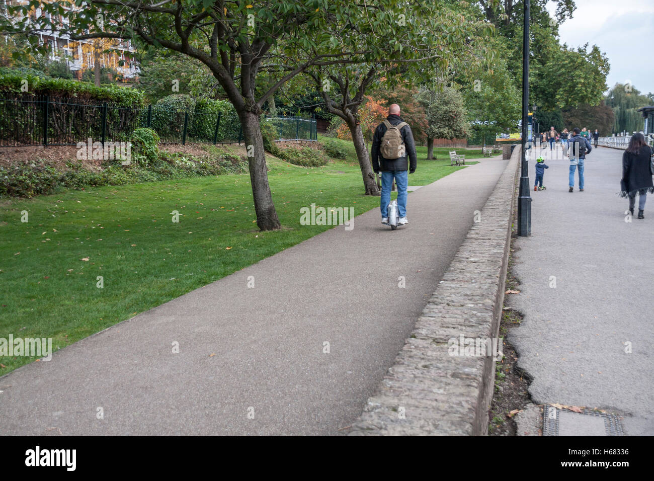 Man riding unicycle hires stock photography and images Alamy