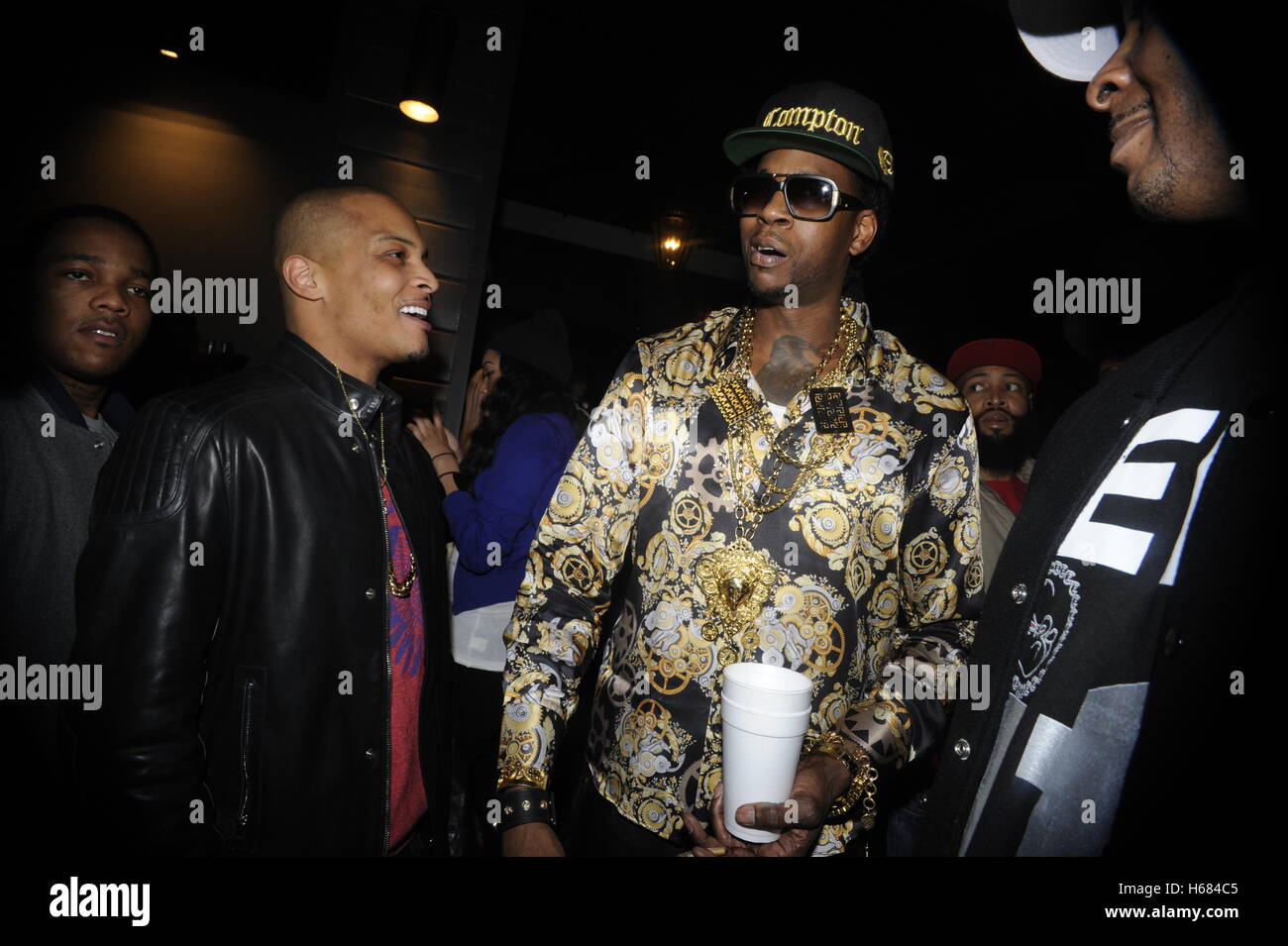 (L-R) EXCLUSIVE: Rappers T.I. and 2 Chainz attends Young Jeezy and 2 Chainz 'RIP' Music Video at Greystone Manor on February 11, 2013 in Los Angeles, California. Stock Photo