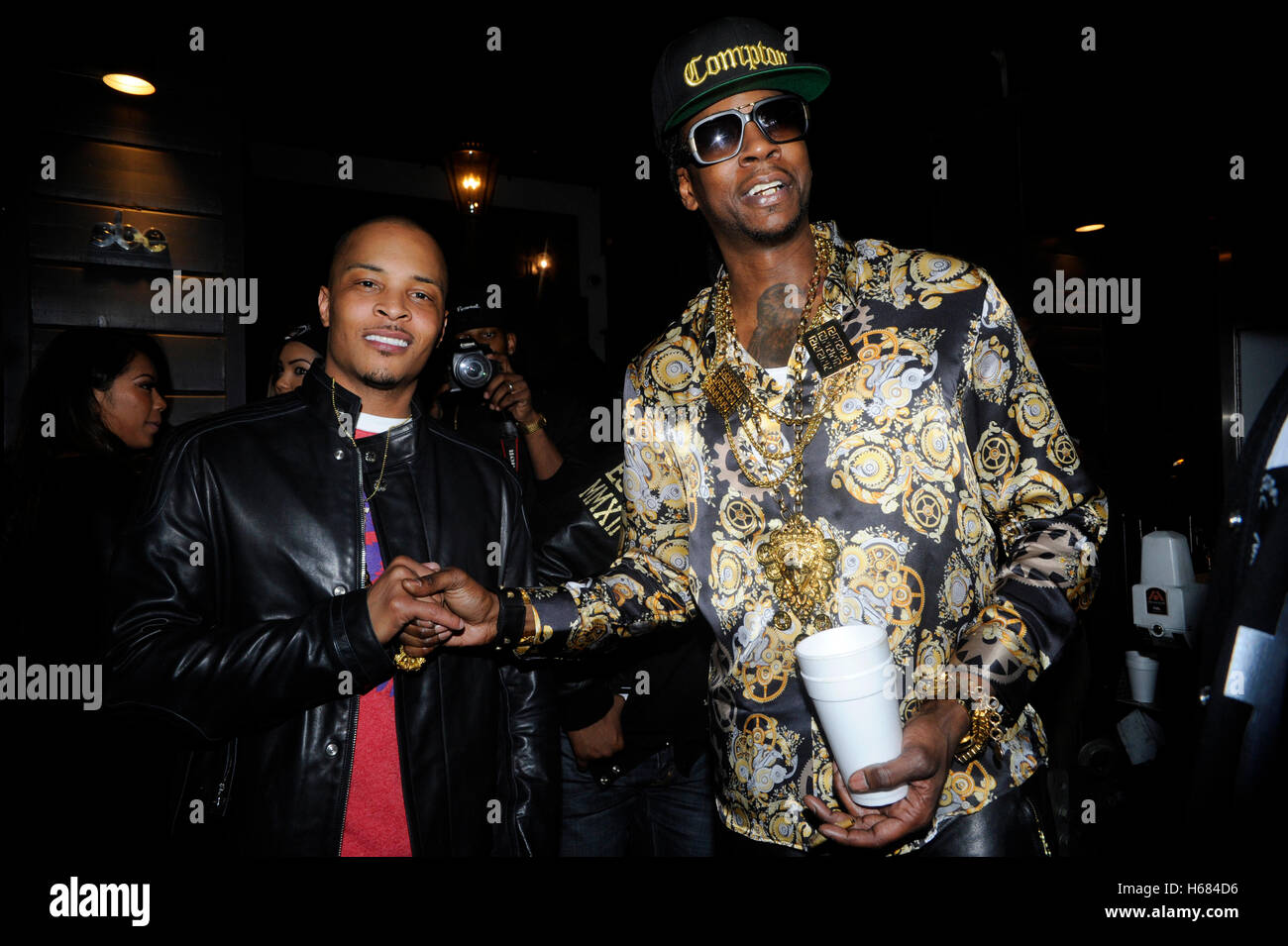 (L-R) EXCLUSIVE: Rappers T.I. and 2 Chainz attends Young Jeezy and 2 Chainz 'RIP' Music Video at Greystone Manor on February 11, 2013 in Los Angeles, California. Stock Photo