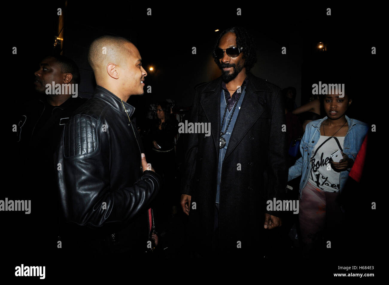 (L-R) Rappers T.I. and Snoop Dogg attends Young Jeezy and 2 Chainz 'RIP' Music Video at Greystone Manor on February 11, 2013 in Los Angeles, California. Stock Photo