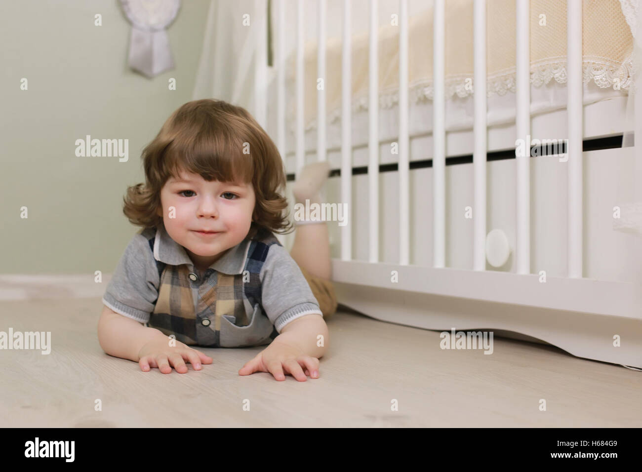 child near bed smiling Stock Photo Alamy