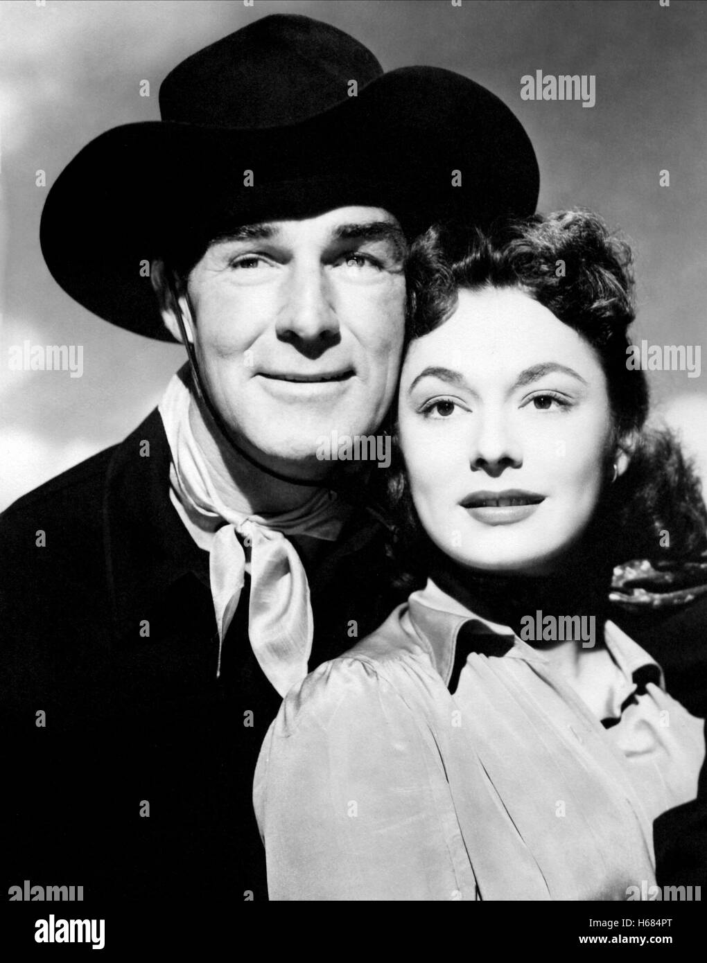RANDOLPH SCOTT, RUTH ROMAN, COLT .45, 1950 Stock Photo