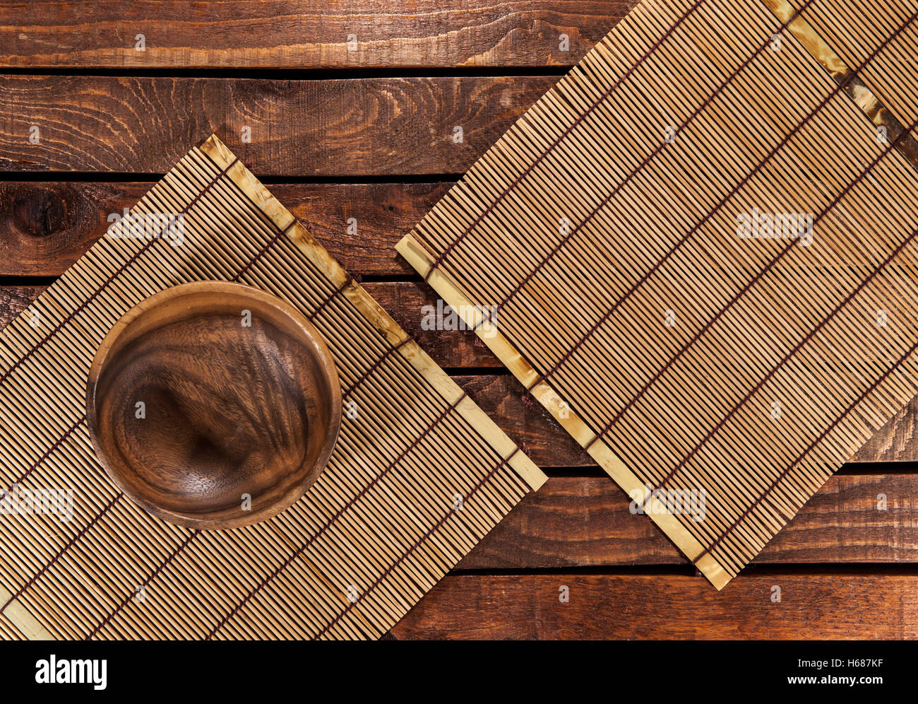 Bamboo mat on wooden table. Top view Stock Photo