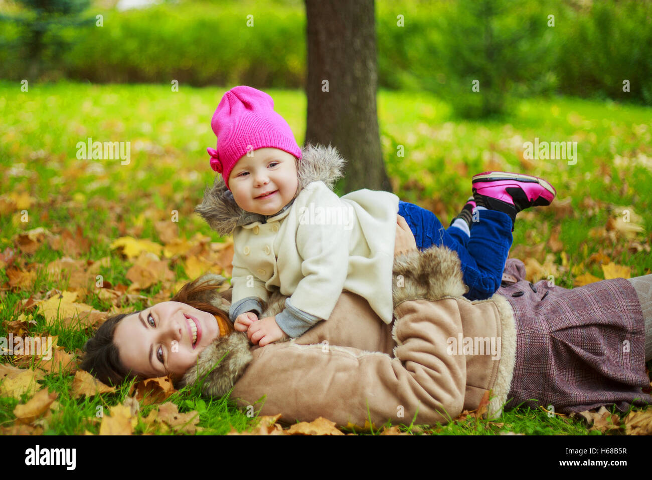 happy mother and her baby in the autumn park Stock Photo - Alamy