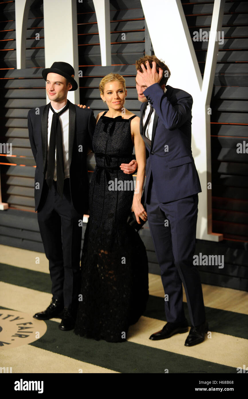 Actors Tom Sturridge, Sienna Miller, and Robert Pattinson attend the 2015 Vanity Fair Oscar Party hosted by Graydon Carter at Wallis Annenberg Center for the Performing Arts on February 22nd, 2015 in Beverly Hills, California. Stock Photo
