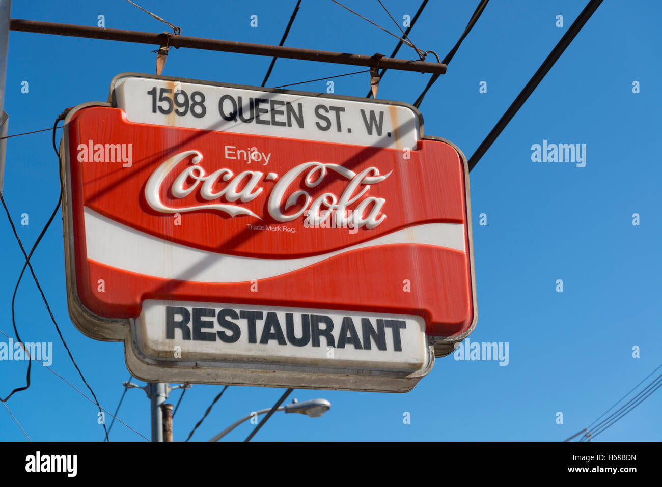 A vintage Coca-Cola restaurant sign on Queen Street West in Toronto, Ontario, Canada. Stock Photo