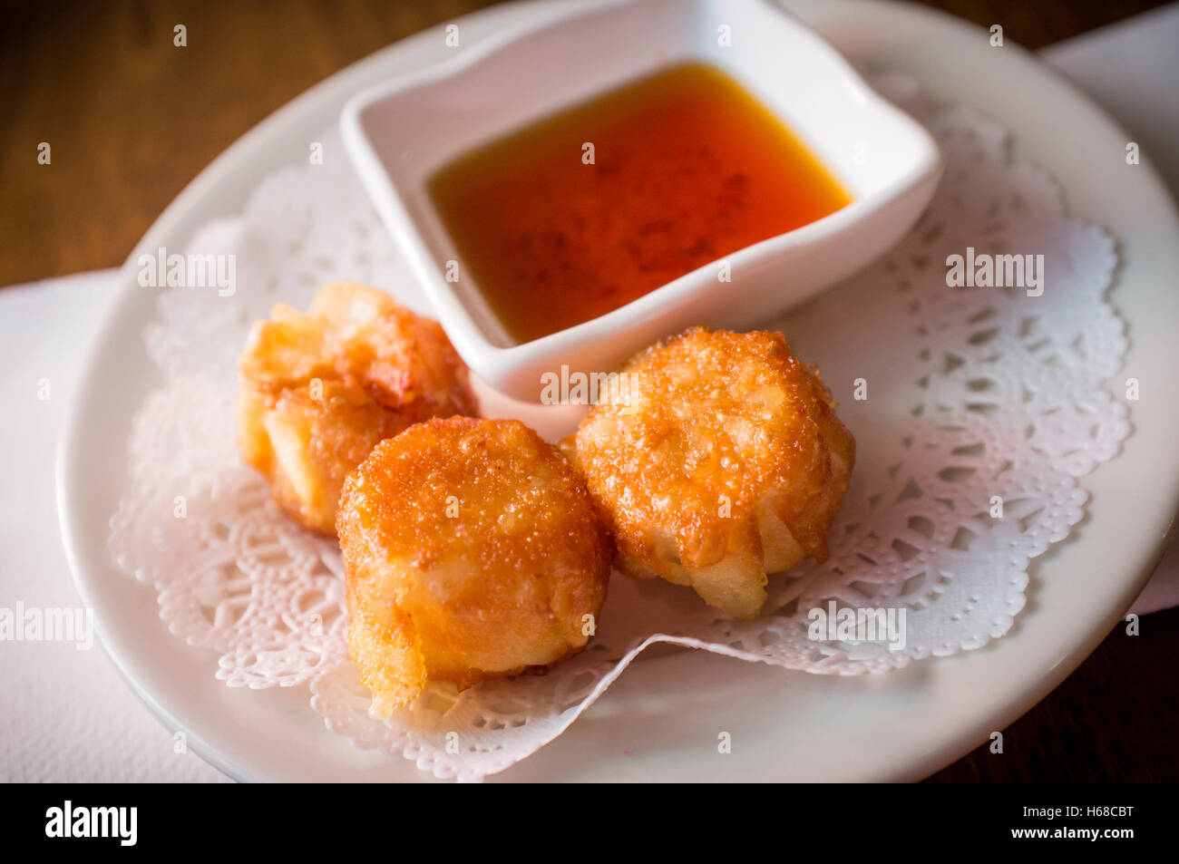 Delicious Chinese Dim Sum Shumai Dumplings Topped With Sweet Sauce Stock Photo Alamy