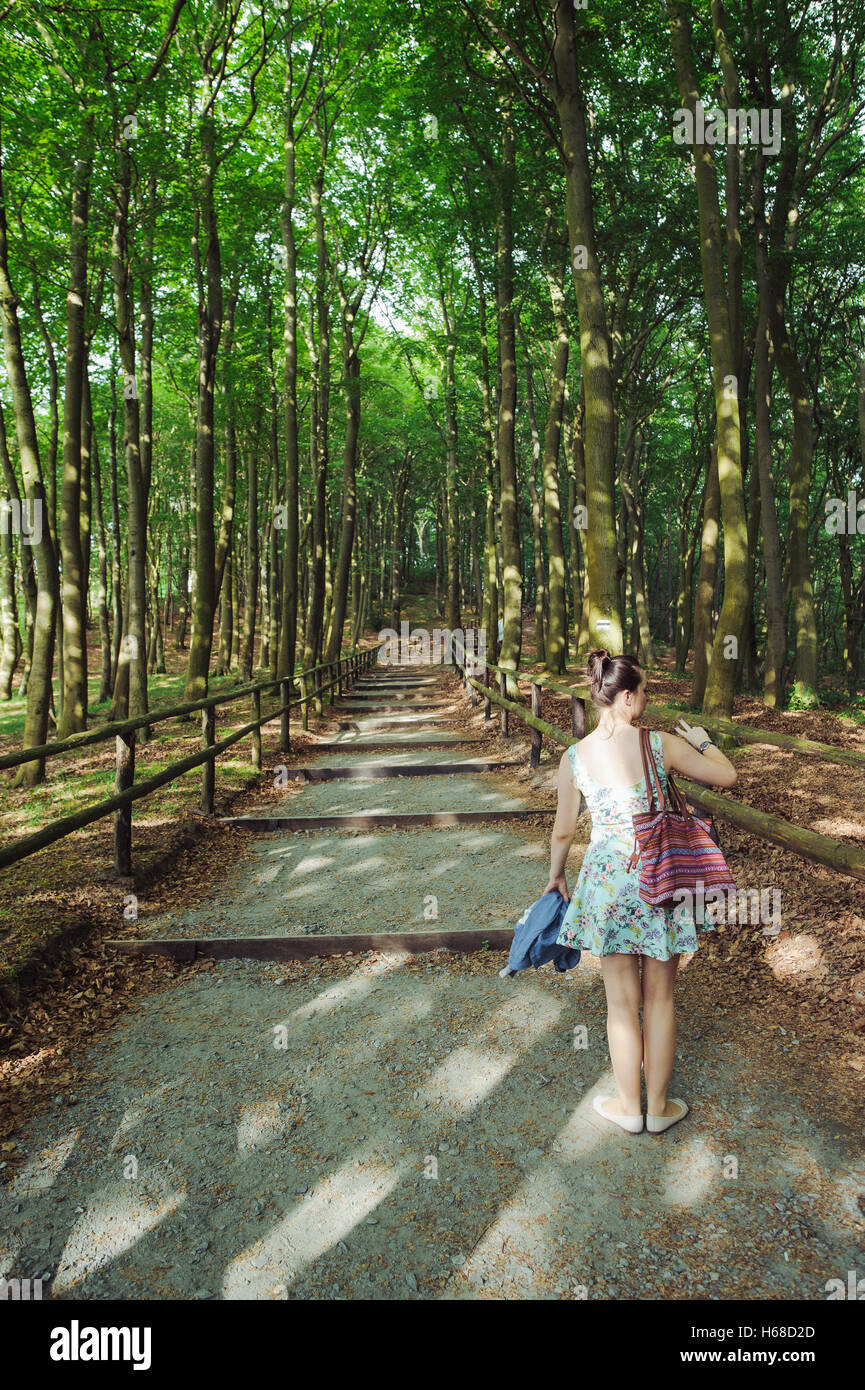 Young girl on a walk in the forest Stock Photo - Alamy