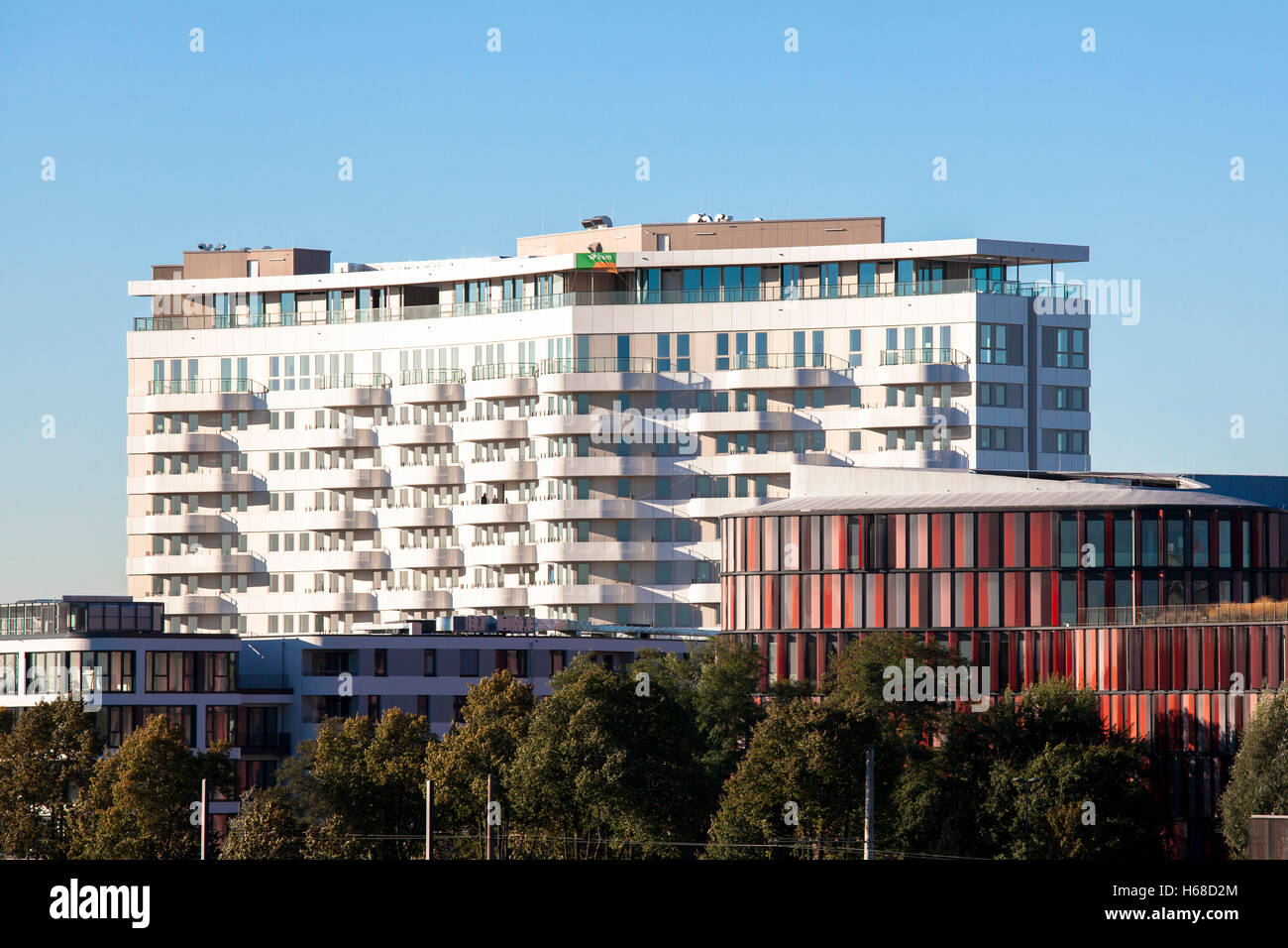 Germany, Cologne, the apartment building Flow Tower in the district Bayenthal, on the right the office building Cologne Oval Off Stock Photo