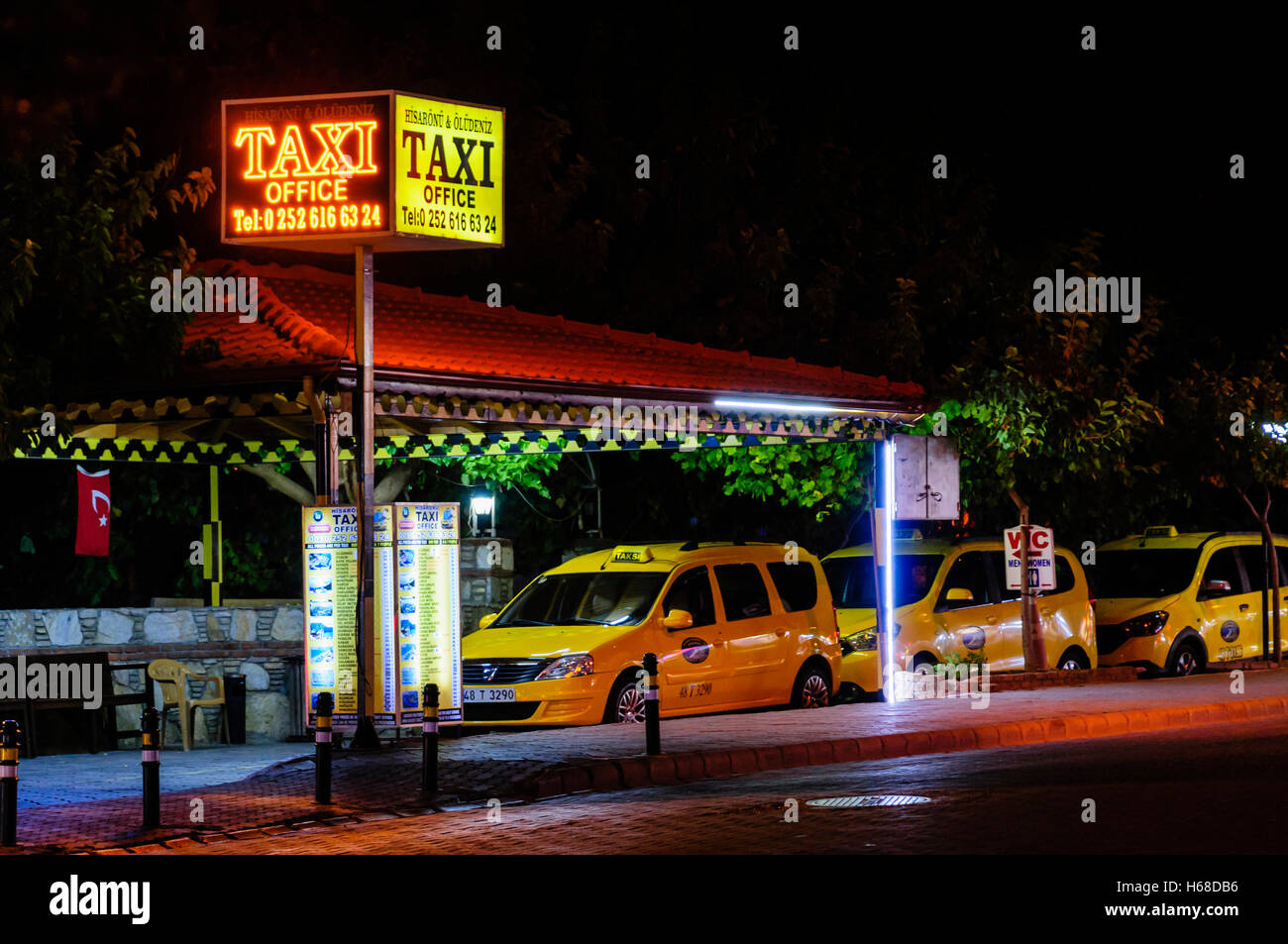 Taxi rank office at night in Hisaronu, Oludeniz, Fethiye, Turkey. Stock Photo